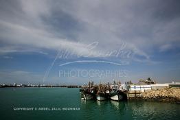 Image du Maroc Professionnelle de  Quelques  bateaux de pêches sont accostés dans le port de Laayoune capitale du Sahara marocain, Samedi 18 Novembre 2006. (Photo / Abdeljalil Bounhar)
 